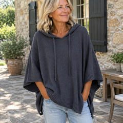 Woman wearing Camille charcoal poncho sweater, lifestyle photo
