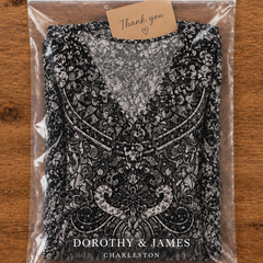 Black and white bohemian print maxi dress folded in Dorothy & James Charleston packaging