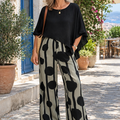 Woman wearing the Kalliope two-piece set outdoors