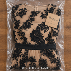 Black lace midi dress folded in Dorothy & James Charleston packaging