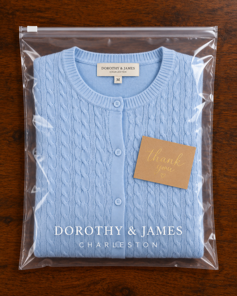 Tilde cable-knit cardigan folded in Dorothy & James Charleston packaging