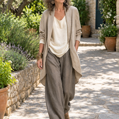 Woman wearing the Simone layered wide-leg linen set in a garden courtyard