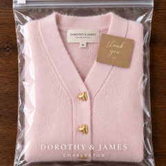 Hazel cardigan folded in Dorothy & James Charleston packaging with thank you card