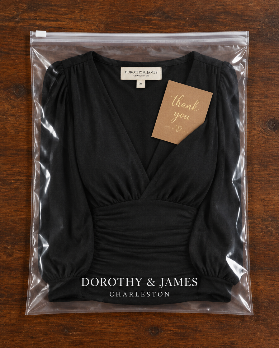 Loravine V-neck top folded in Dorothy & James Charleston packaging with thank you card