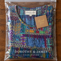 Manuela patchwork dress folded in Dorothy & James Charleston packaging with thank you card