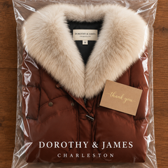 Elsie coat folded in Dorothy & James Charleston packaging with thank-you card