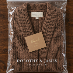 Alice Cozy Confidence Longline Cardigan folded in Dorothy & James Charleston packaging with thank you card