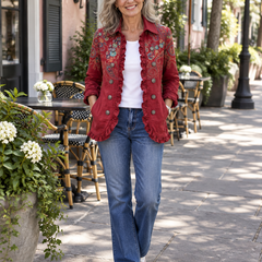 Woman wearing the Fayrene red paisley ruffle jacket over a white tee and jeans