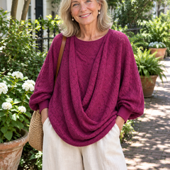 Woman wearing the wine red cowl-neck lantern sleeve top with linen pants