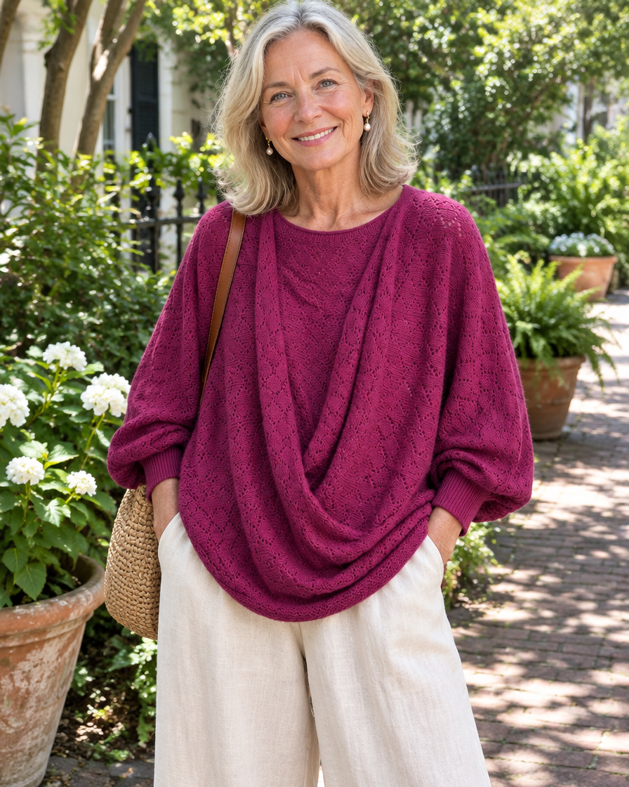 Woman wearing the wine red cowl-neck lantern sleeve top with linen pants