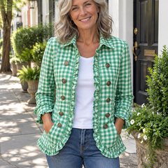 Woman wearing the green gingham ruffled button-down jacket with jeans