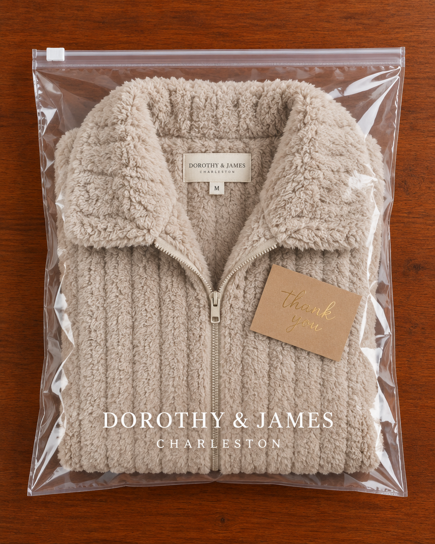 Cozy plush zip-up jacket folded in Dorothy & James Charleston packaging with thank you card