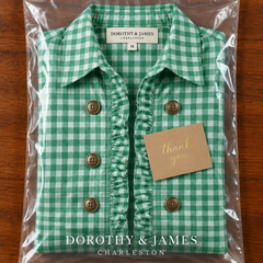 Gingham ruffled jacket folded in Dorothy & James Charleston packaging with thank you card