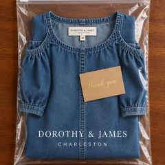 Denim maxi dress folded in Dorothy & James Charleston packaging with thank you card